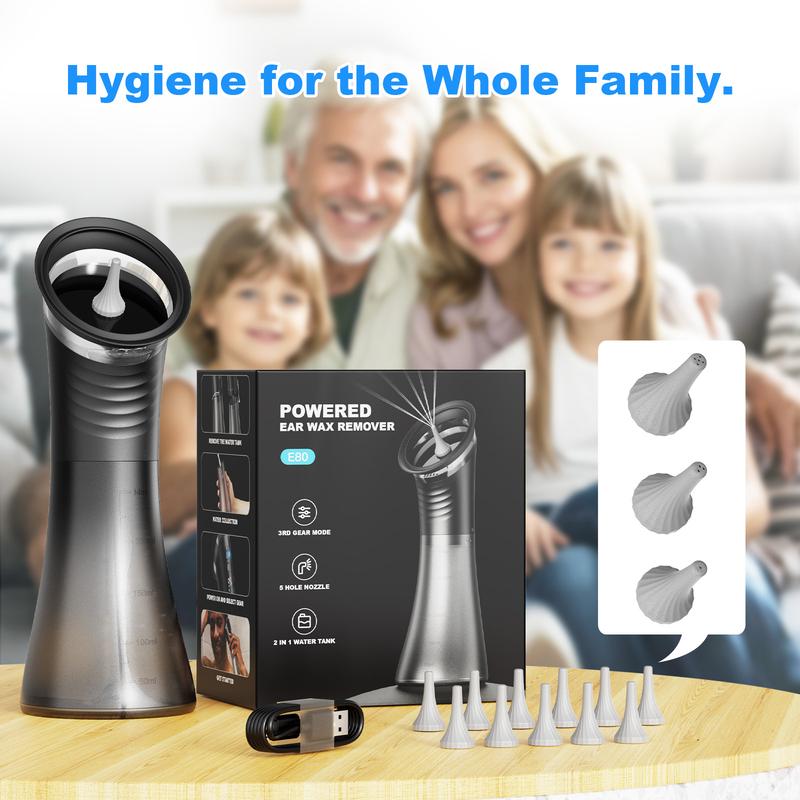 Powered ear wax remover with packaging and attachments on a wooden surface, family in the background.